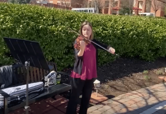 Violinist playing outside